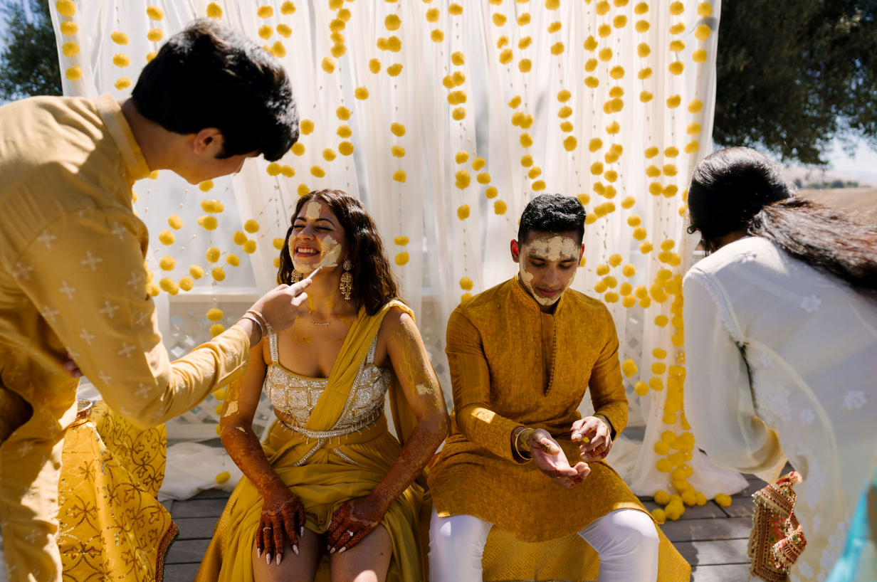 Guests participate in a multi-day wedding celebration featuring traditional pre-ceremony rituals supported by all inclusive wedding services at Léal Vineyards.