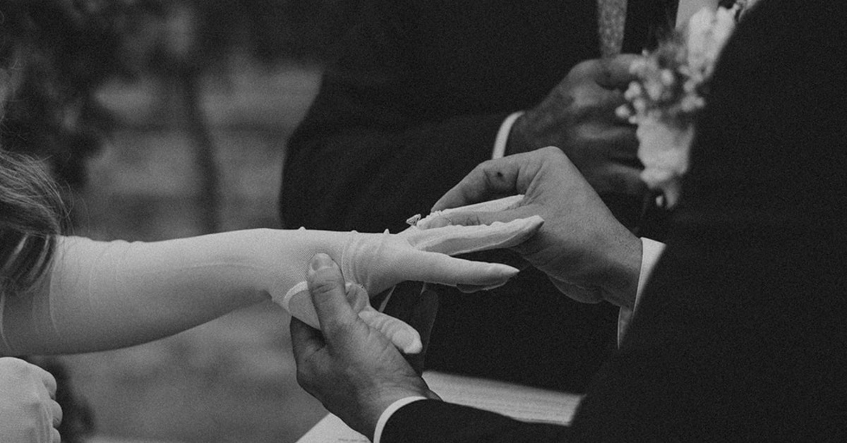 Bride and groom exchanging rings during ceremony with all inclusive wedding services ensuring seamless coordination