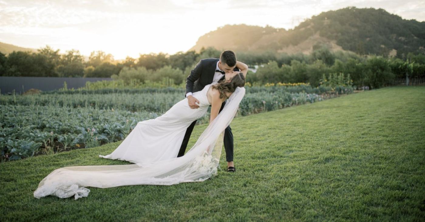 Bride and groom at sunset celebrating a California vineyard wedding at Léal Vineyards