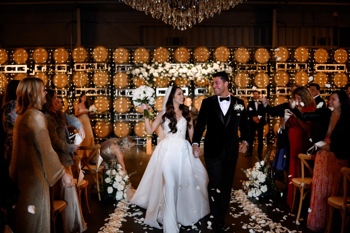 Vineyard wedding celebration at a winery in Hollister CA with elegant decor and guests celebrating the couple