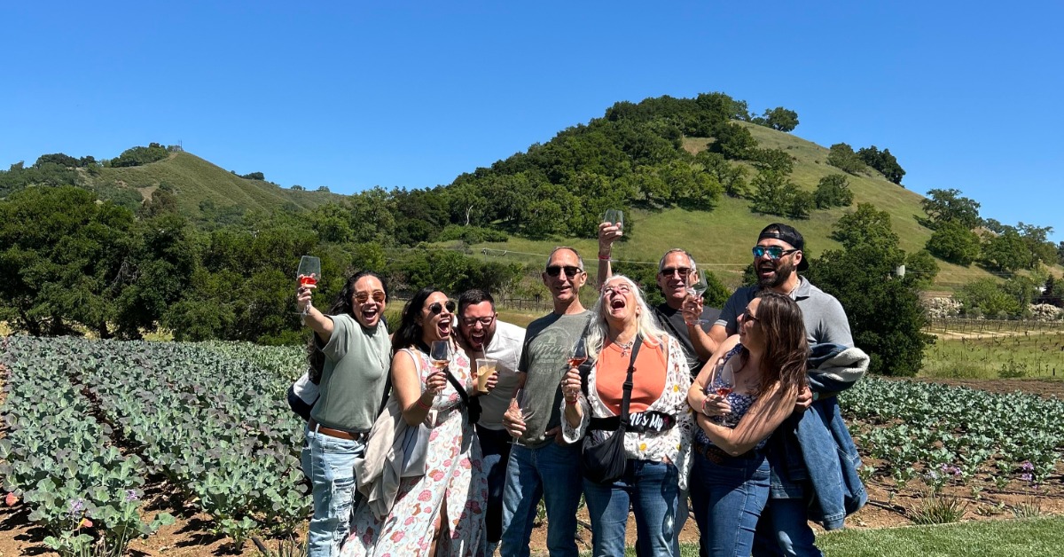 Corporate gala guests enjoying networking and wine tasting at a California wine country private event venue