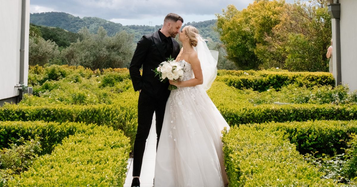 Elegant bride and groom portrait in manicured gardens at a vineyard wedding venue near Morgan Hill
