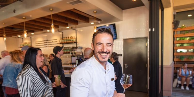 Holding a glass at MOHI Food and Wine festival